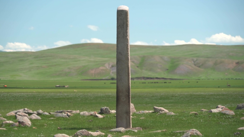 Inscription of obelisk menhir from old ancient times.Deer stone megalith carved with symbols.Deerstone stele history historical antique petroglyph monument memorial archaeology straight kurgan grave 