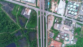 Aerial drone top view of highway junction road Bridge with moving cars Active movement of transport cars vehicles in different directions,Top down view video Business transportation concept