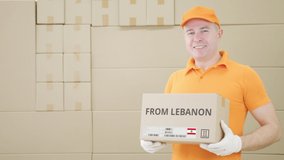 Warehouse worker holds parcel with FROM LEBANON text on it - Powered by Shutterstock - Get 15% off with code: PIKWIZARD15