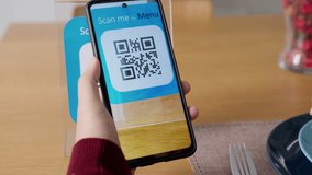 Hand's customer scan QR code for online menu service at table in restaurant during pandemic coronavirus. New normal contactless technology lifestyle protection coronavirus pandemic in restaurant - Powered by Shutterstock - Get 15% off with code: PIKWIZARD15