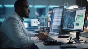 Modern Electronics Development Facility: Male Engineer Works on Computer with CAD Programming Software. Scientists Design of Industrial PCB, New Generation Silicon Microchips, Semiconductors - Powered by Shutterstock - Get 15% off with code: PIKWIZARD15