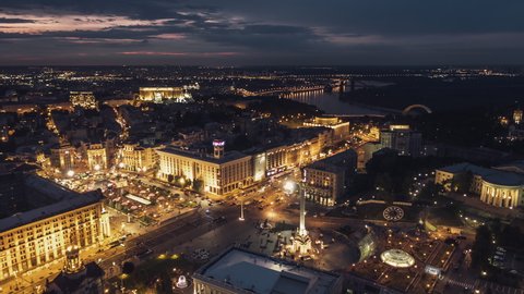 Establishing Aerial View Shot of Kyiv Kiev, Independence Square, Maidan Nezalezhnosti, Ukraine, at evening night, beautifully lit