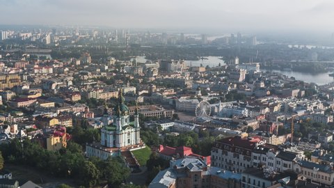 Establishing Aerial View Shot of Kyiv Kiev, St. Andrew's Church, Baroque East Orthodox, Ukraine, sun over city