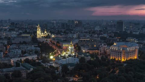 Establishing Aerial View Shot of Kyiv Kiev, St. Sophia's Cathedral, St. Michael's Golden-Domed Monastery and Ministry of Foreign Affairs of Ukraine, Ukraine, at sunset evening  night