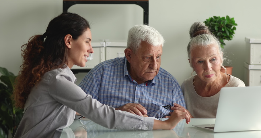 Happy aged couple clients shake hands with advisor agent lawyer after sign a contract make deal, express gratitude for qualified consultation received. Insurer sell medical insurance services concept Royalty-Free Stock Footage #1065349267