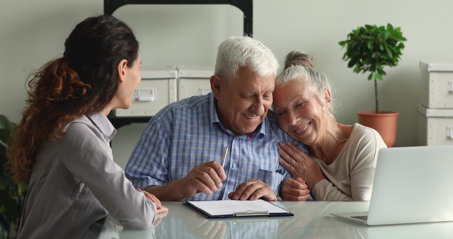 Happy aged couple clients shake hands with advisor agent lawyer after sign a contract make deal, express gratitude for qualified consultation received. Insurer sell medical insurance services concept | Shutterstock HD Video #1065349267