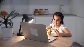Kids distance learning. Cute little girl using laptop at home. Education, online study, home studying, technology, science, future, distance learning, homework, schoolgirl children lifestyle concept.