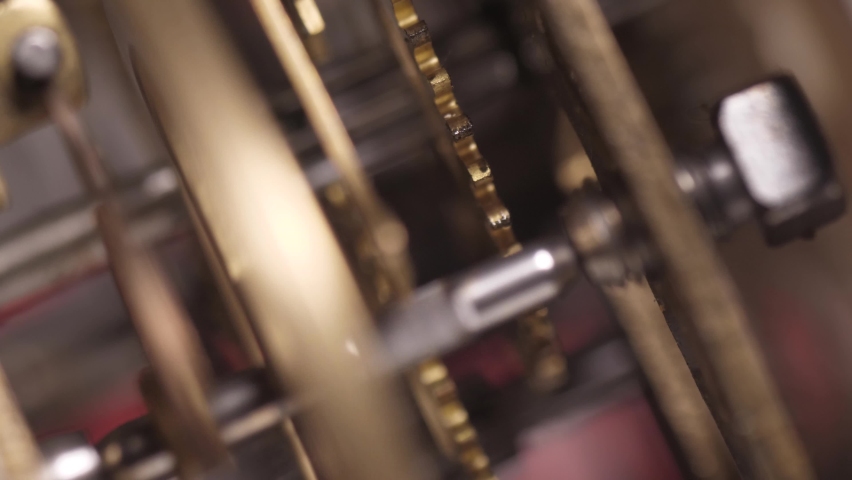 Old clock mechanism with metal gears macro shot slow motion 4k | Shutterstock HD Video #1065373186