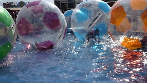 Skopje, Macedonia - 25 Oct, 2019: Children are playing in zorb balls on the water