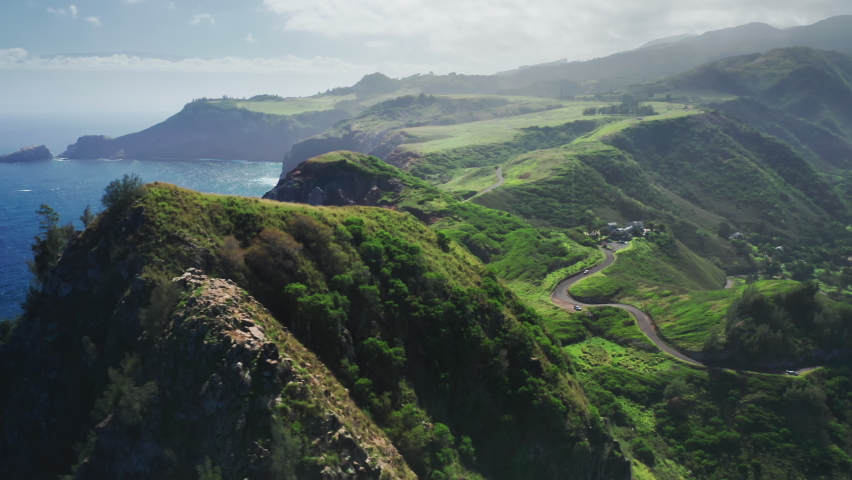Cinematic aerial panorama wild nature of tropical island, Maui coast, Hawaii USA. World famous winding road scenic green coastline favorite tourist attraction. Outdoors travel and nature background 4K