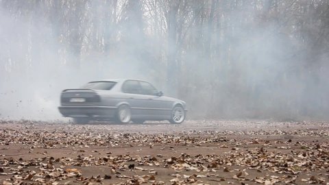Chernigov, Ukraine - November 8, 2017: BMW M5 drifts. BMW in the autumn park. Drift. Burnout