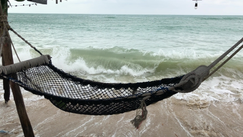 Hammock over the rolling sea. Kho Phangan, Thailand