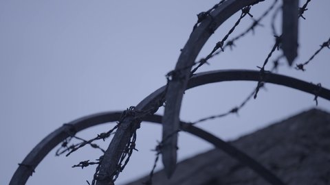 A camera movement with a telephoto lens on an old, rusted, wire fence in Warsaw Ghetto, a 4K (Sony S-Log) video clip, Warsaw, Poland.