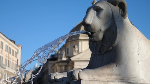 The Lion Fountain in Piazza del Popolo in Rome, Italy.
Close-up of the water flowing from the fountain in the Piazza del Popolo in Rome

