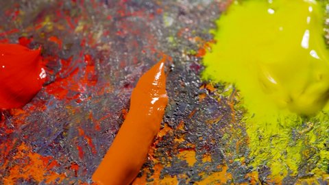 Multi-colored oil paints on an artistic palette.