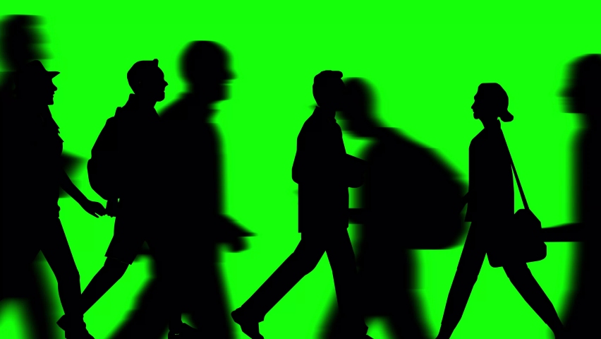 Animation of a large crowd crossing (4K video). Silhouette version. Animation of camera zooming in. green background for background transparent use