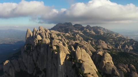 Aerial views of Montserrat peaks, a mountain range in Catalonia. Montserrat conglomerate crags, a huge vertical fingers multi peaks taken by drone in a unique place on earth in the Catalonia region