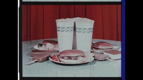 1950s Augusta, Georgia. Drive-in Movie Theater Intermission Announcement. Castleberry's Real Southern BBQ Intermission Snipe. Still Life of Plated Food. 4K Overscan of Archival 16mm Film Print