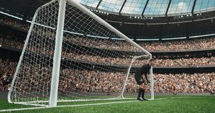 4k shot of goalkeper saving from the goal on the professional stadium made in 3d with animated crowd. Sunny weather.