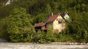 Cozy alpine houses with tile roofs on the bank of river Lech, Fussen