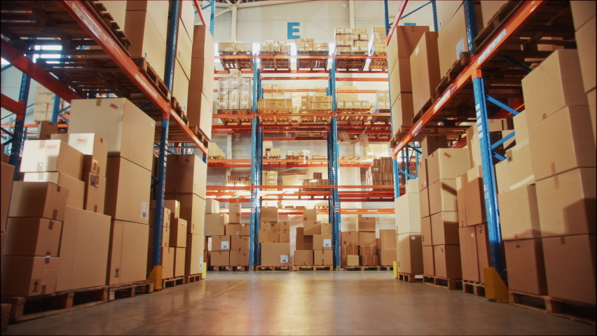 Future Technology 3D Concept. Complete Digitalization and Automatization of Retail Warehouse. AGV Robots Moving Cardboard Boxes in Logistics Center. Automated Guided Vehicles Delivering Packages | Shutterstock HD Video #1065465016