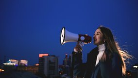 Woman feminist joy victory strike shout loudspeaker close up. Girl speak in megaphone female rights. Happy person shouting loudspeaker night. Activist feminism talking megaphone victory gender rally. - Powered by Shutterstock - Get 15% off with code: PIKWIZARD15