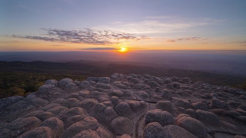 Time lapse of dry rock stones in Lan Hin Pum, Phu Hin Rong Kla National Park, Phitsanulok, Thailand. Mountains hill view with the park landscape. Tourist attraction and sunset skyline.
