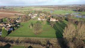 Aerial footage of the British country side fields in the winter time, taken in the town of Wetherby in Yorkshire in the UK in the winter time on a clear sunny day