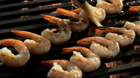 Shrimp cooking on grill in slow motion. Shot with Phantom Flex 4K camera.