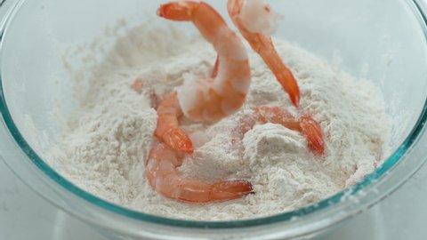 Shrimp falling into flour in slow motion. Shot with Phantom Flex 4K camera.