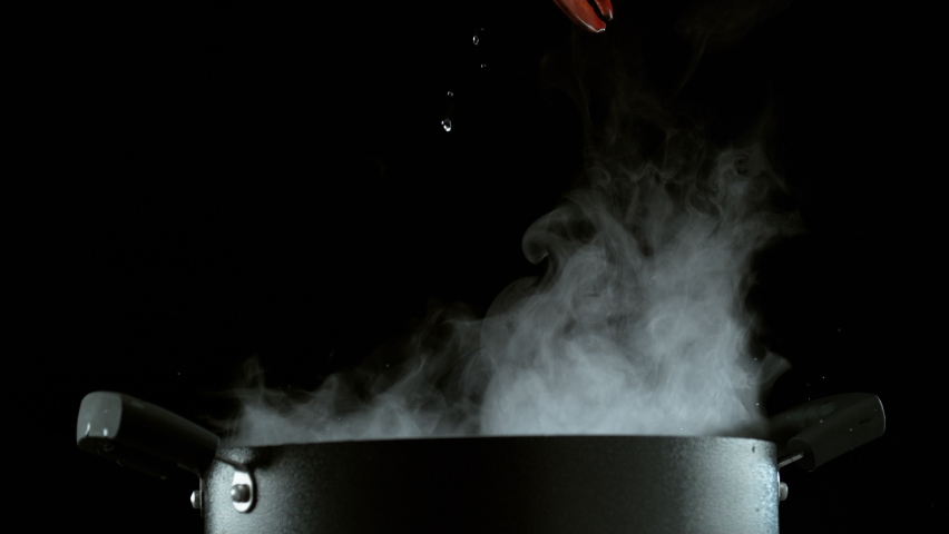 Lobster falling into boiling pot in slow motion. Shot with Phantom Flex 4K camera.