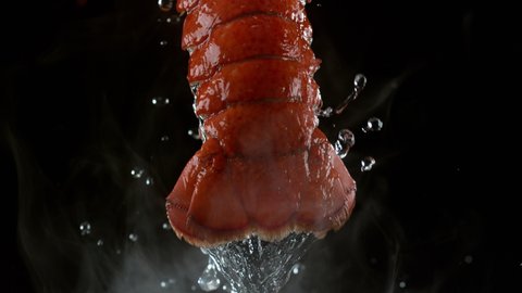 Lobster tail steaming with water dripping in slow motion. Shot with Phantom Flex 4K camera.