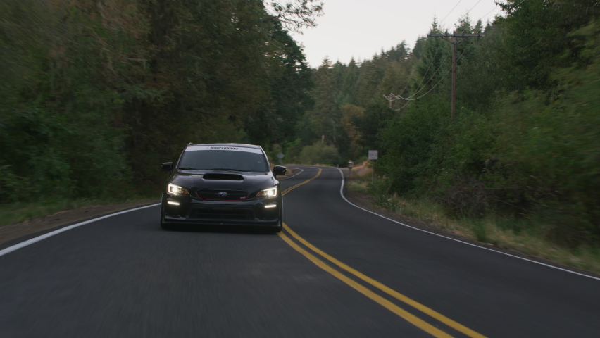 Oregon circa-2020: Subaru sports car driving on rural road | Shutterstock HD Video #1065496858