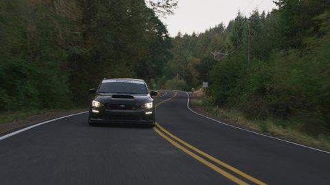 Oregon circa-2020: Subaru sports car driving on rural road