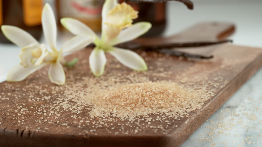Vanilla beans falling onto sugar in slow motion. Shot on Phantom Flex 4K camera. | Shutterstock HD Video #1065496969