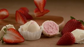 Strawberry White Chocolate truffle with ingredients falling in slow motion. Shot with Phantom Flex 4K camera. - Powered by Shutterstock - Get 15% off with code: PIKWIZARD15
