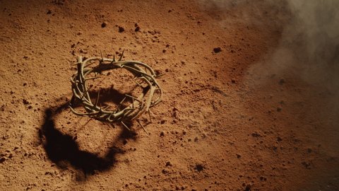 Crown of thorns like Jesus wore on dusty surface. Shot with RED 8K camera.