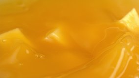 Mango chunks falling into mango juice in slow motion. Shot with Phantom Flex 4K camera. - Powered by Shutterstock - Get 15% off with code: PIKWIZARD15