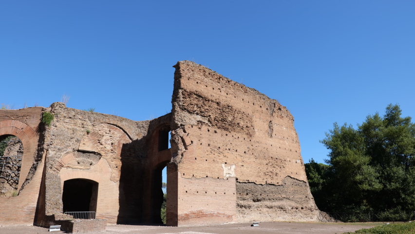 Baths of Caracalla ruins in city of Rome, Italy, ancient Roman public baths, built between AD 212 to 216 under direction of Marcus Aurelius (Emperor Caracalla), panning to the left in 4k
