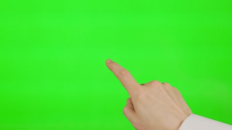 The Man Touches The Center Of The Digital Device's Large Touch Screen With His Finger. The Male Finger Touches The Green Background, Green Screen, Alpha Channel, Chromakey, Mockup.: film stockowy
