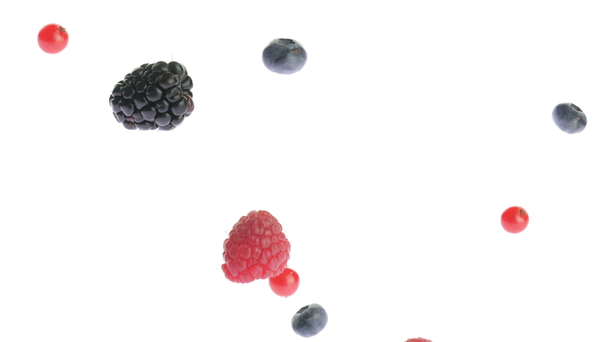 Berries mix flying, falling and floating in the air, isolated on white background. Variety of forest berry: raspberries, blueberries, blackberries and red currants. Slow motion video 4k. Juicy fruit. Royalty-Free Stock Footage #1065530602