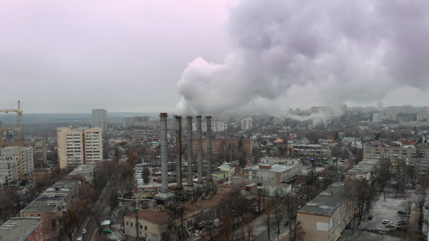Establishing Aerial View Shot of industrial district of Kharkiv, Ukraine - smoke from industrial pollution of the atmosphere - concept of air pollution from industrial human activities in the city. Royalty-Free Stock Footage #1065535399