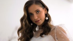 Fashion portrait of dancing beautiful bride in white dress polka dots - Powered by Shutterstock - Get 15% off with code: PIKWIZARD15