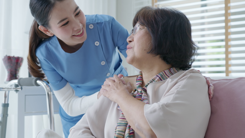 Young asian woman or nurse home care hand on senior grandmother shoulder give support empathy to elderly lady or older people in assisted living homecare mental health sick relief concept. | Shutterstock HD Video #1065543307