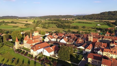 Aerial drone footage of the Avanches medieval old town in Canton Vaud in Switzerland on a sunny summer day with a rotation motion