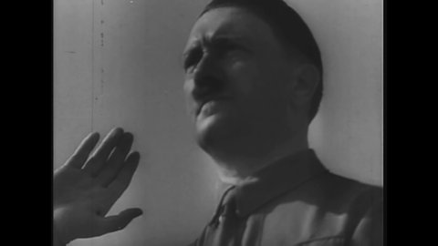 CIRCA 1940s - Adolf Hitler gives a speech rousing his countrymen to see themselves as the master race.
