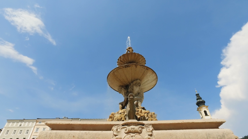 Famous fountain on Residenzplatz square in the old historic part of Salzburg, Austria.