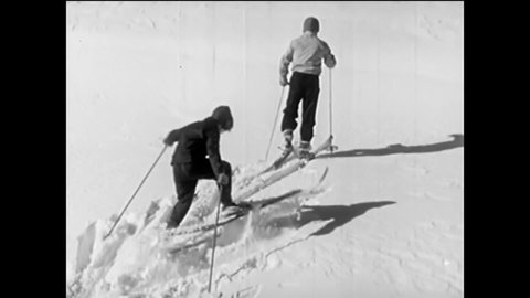 CIRCA 1940s - Three children put on skis and proceed to ski on fresh snowfall, with varying levels of success relative to their age and experience.
