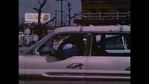 CIRCA 1960s - Men exit a car in funny sweaters; a man jumps up and down during his physical; a film reel goes haywire in the projector in 1964.