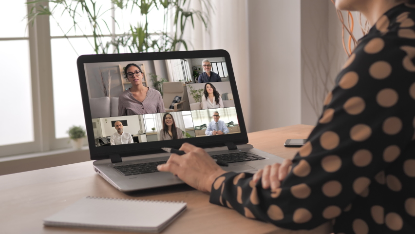 Working on project online,diverse multiethnic group of people having a video chat conference,back view of a business person chatting with colleagues using web aap on computer screen | Shutterstock HD Video #1065569302